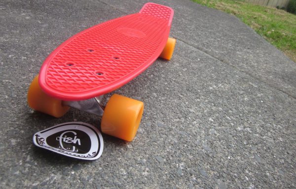 Red board with orange wheels